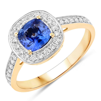 Genuine blue sapphire and white diamond ring in 18K yellow gold, featuring a cushion-cut sapphire and diamond halo.