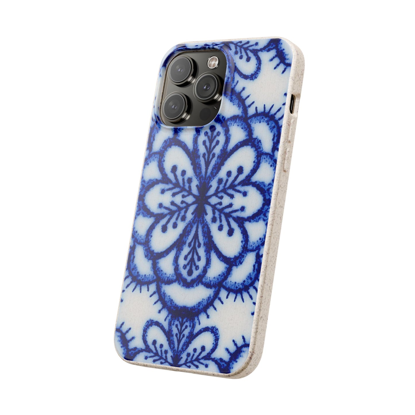 A protective phone case with a blue and white floral mandala pattern, shown on a light-colored smartphone against a plain white background.