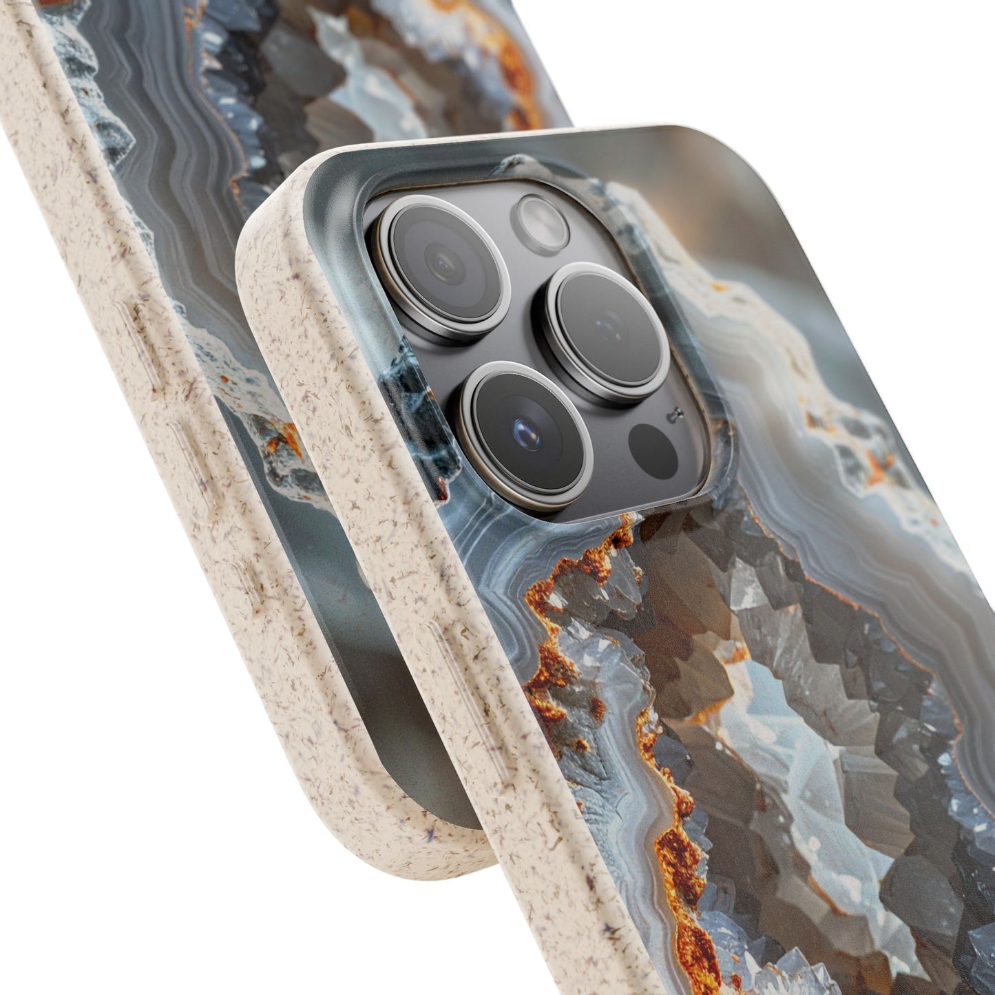 A close-up of a smartphone case with a geode or agate-style pattern in gray, blue, white, and rust-orange tones, with a speckled beige border. The phone camera cutout is visible, and the case is shown on a clean white background.