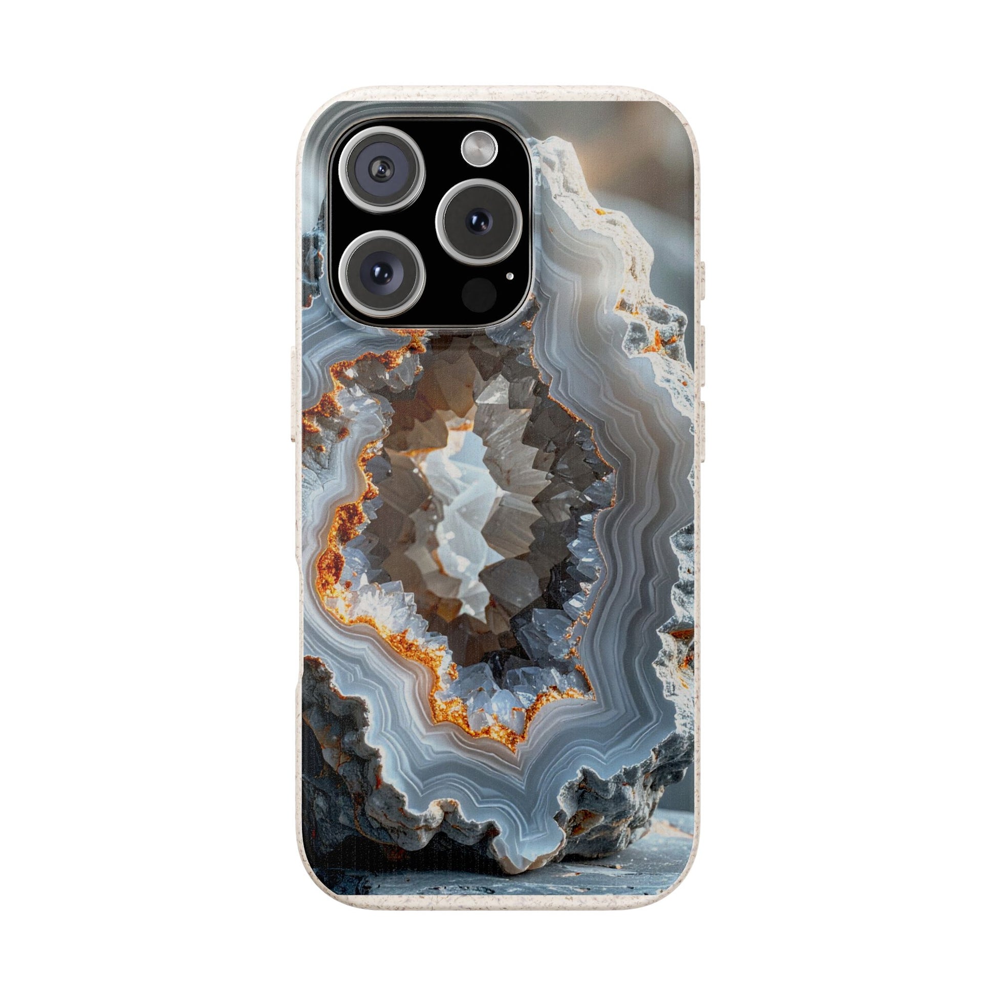 A phone case featuring a detailed geode or agate crystal pattern with concentric bands of gray, white, brown, and orange, shown on a light gray background.