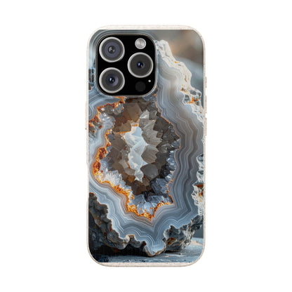 A phone case featuring a detailed geode or agate crystal pattern with concentric bands of gray, white, brown, and orange, shown on a light gray background.