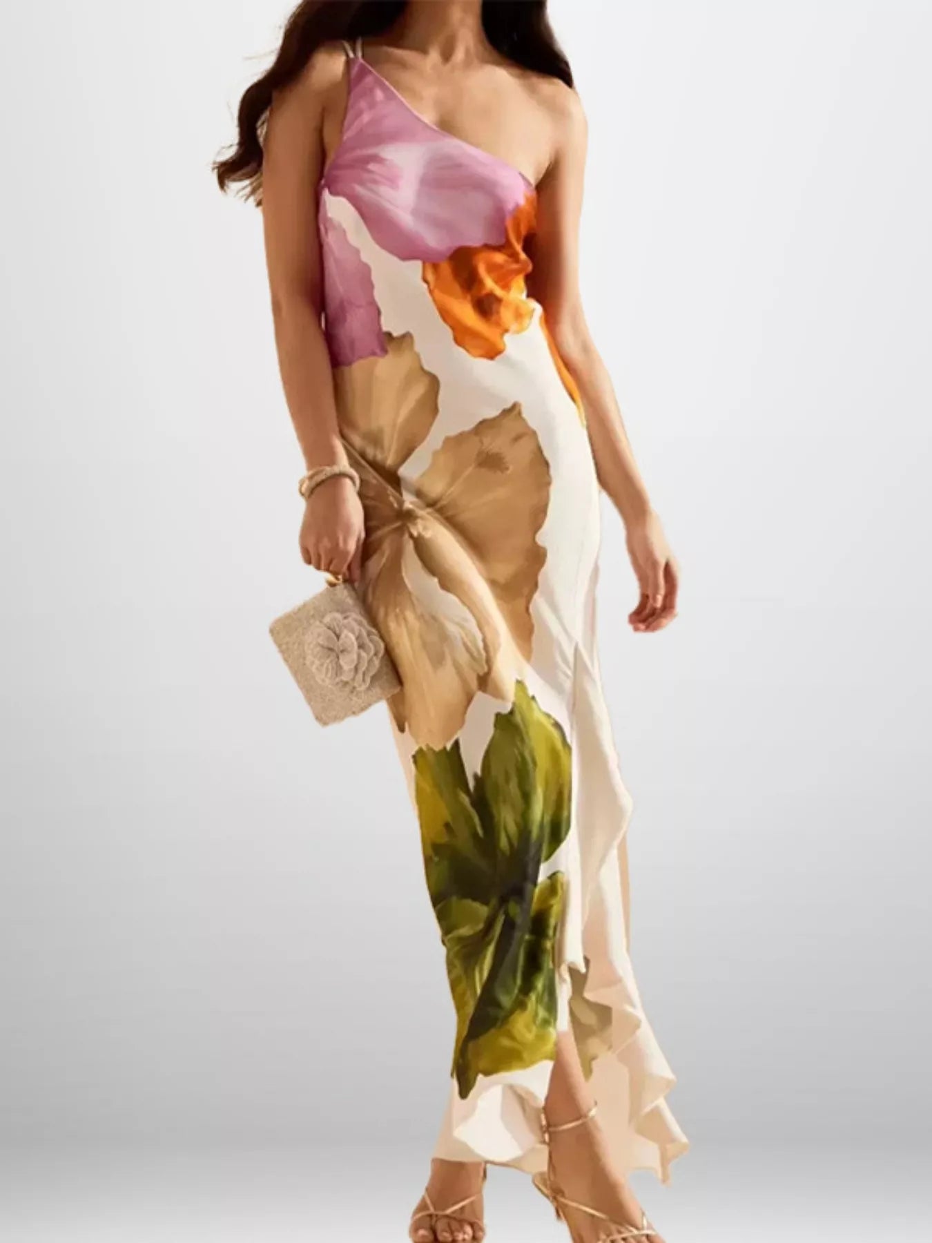 Woman wearing a colorful floral dress on a white background
