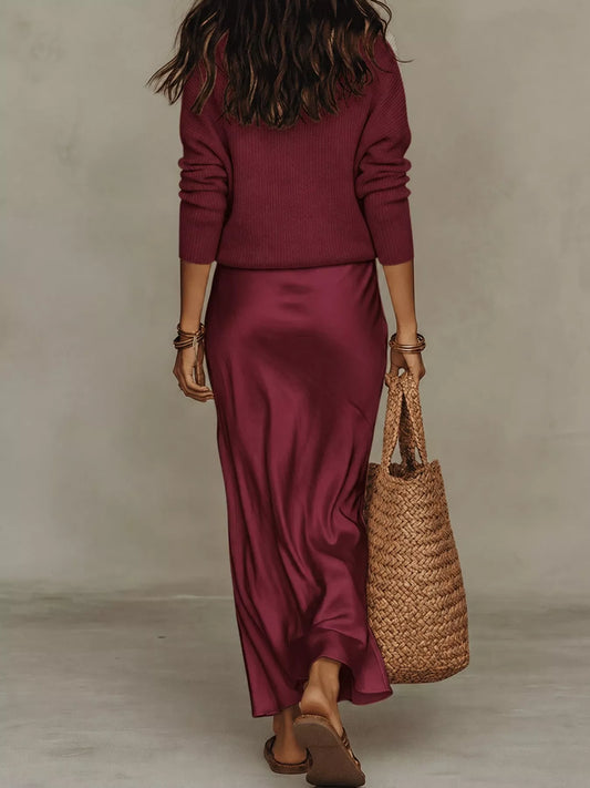 Back view of burgundy ribbed top and satin midi skirt set.