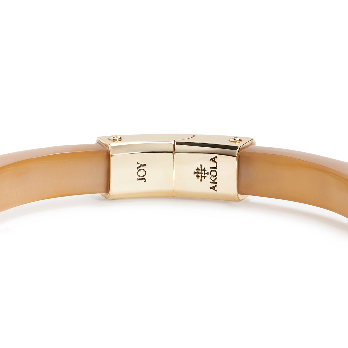 Gold bracelet with 'AKOLA' clasp on a white background