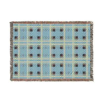 A rectangular woven throw blanket with a light blue plaid pattern, cream and olive green intersecting stripes, and dark brown checkered squares, finished with fringed edges.