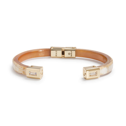 Bracelet with gold accents on a white background