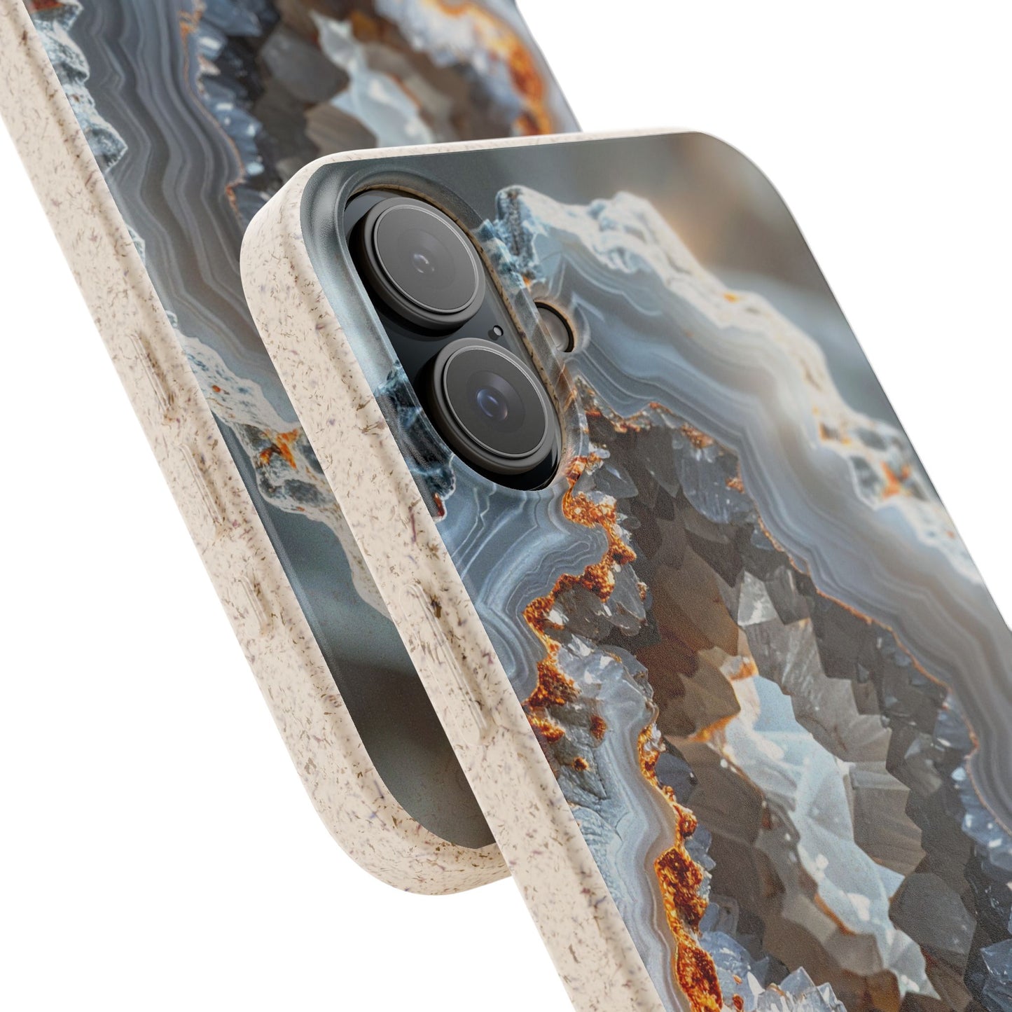 Close-up of a smartphone case with a geode-inspired agate pattern in gray, blue, white, and rust-orange tones, with a light beige textured bumper edge. No person, animal, or real environment is present.