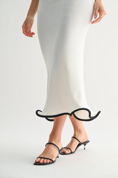 Black high-heeled shoes with unique design on a white background