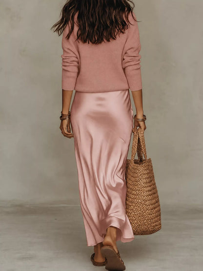 Back view of pink ribbed top and satin midi skirt set.