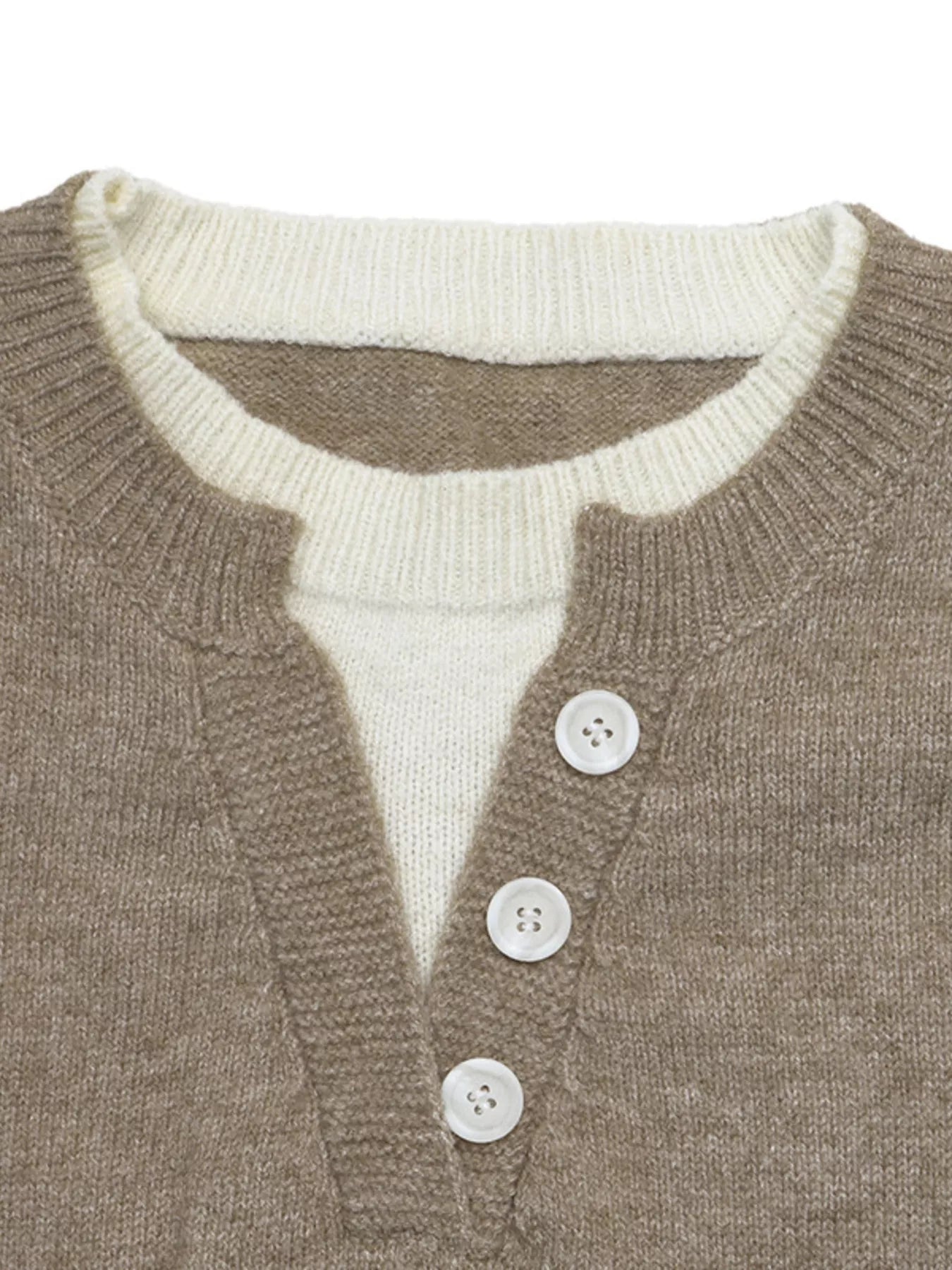 Close-up of a knit sweater showing a taupe-brown outer layer with a cream ribbed inner collar and three white buttons on a plain white background.