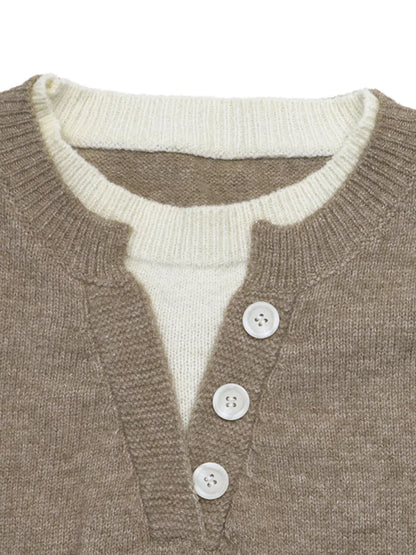Close-up of a knit sweater showing a taupe-brown outer layer with a cream ribbed inner collar and three white buttons on a plain white background.