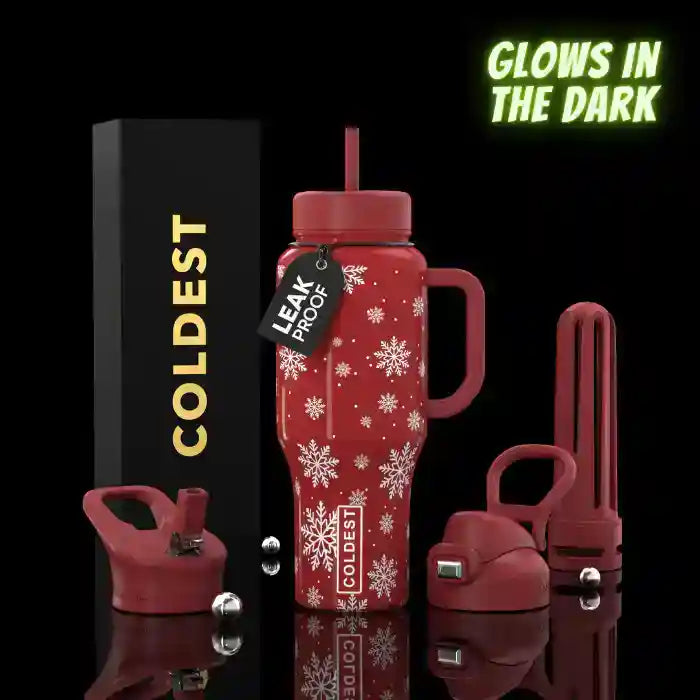 Red insulated water bottle with snowflake design, 'Coldest' branding, and 'Glow in the Dark' text on a black background.