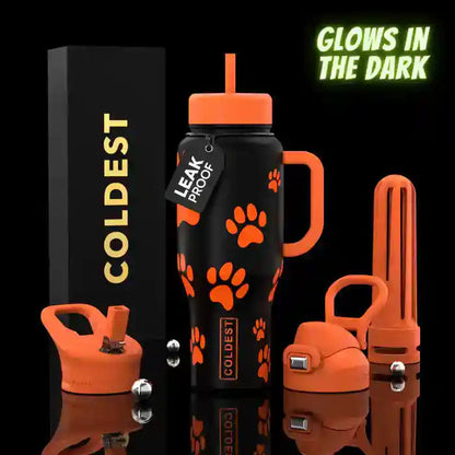 Black water bottle with orange accents featuring paw prints, surrounded by additional bottle parts on a black background.