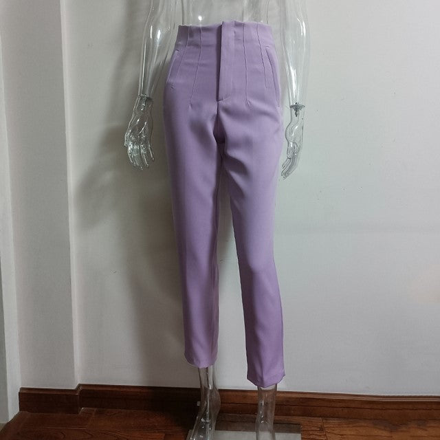 Purple pants on a transparent mannequin against a white wall.
