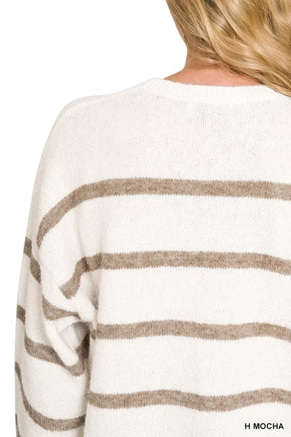 Close-up back view of a person wearing a fuzzy knit sweater with horizontal taupe-brown stripes on an off-white base. The text 'H MOCHA' appears in the bottom right corner.