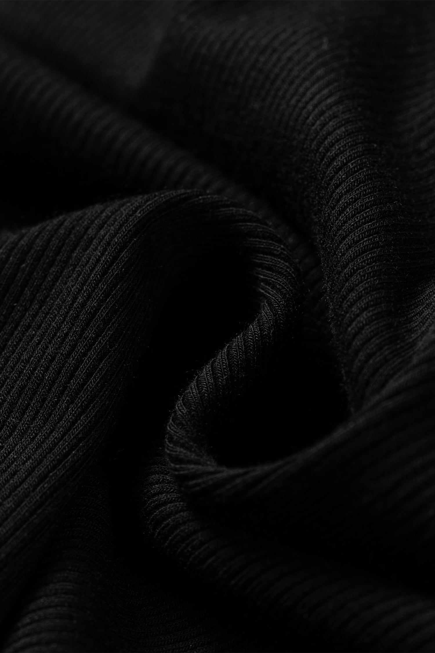 Close-up of black ribbed fabric texture