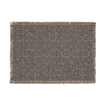 Reverse side of a rectangular woven throw blanket with a brown and gray plaid pattern, accented by teal and orange threads, finished with fringed edges, shown flat on a white background.