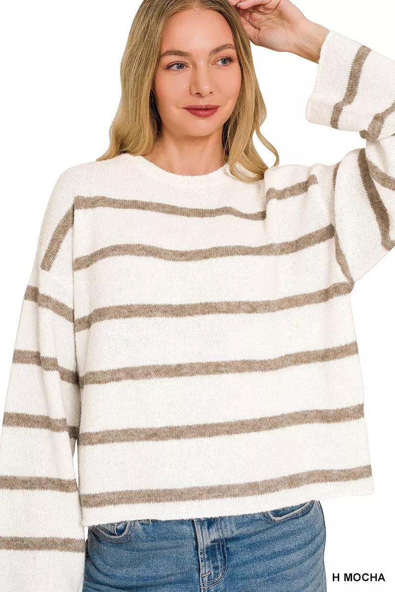 woman wearing striped wool blend sweater with jeans