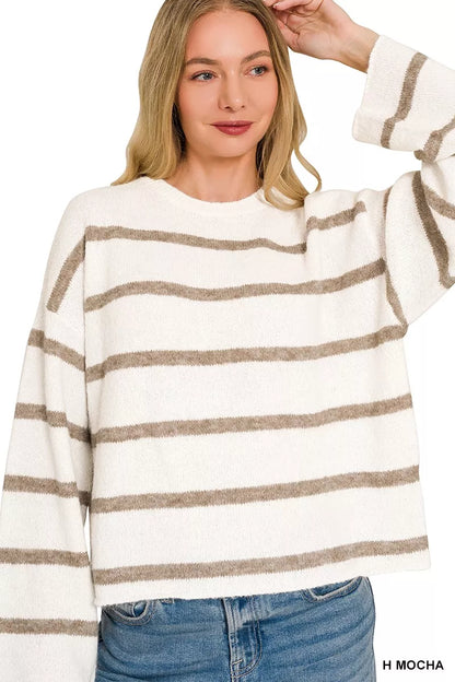 woman wearing striped wool blend sweater with jeans