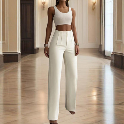 Woman wearing a white outfit in an elegant hallway