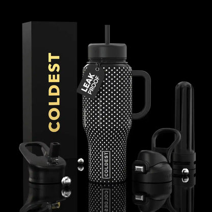 Black water bottle with white polka dots and accessories on a black background
