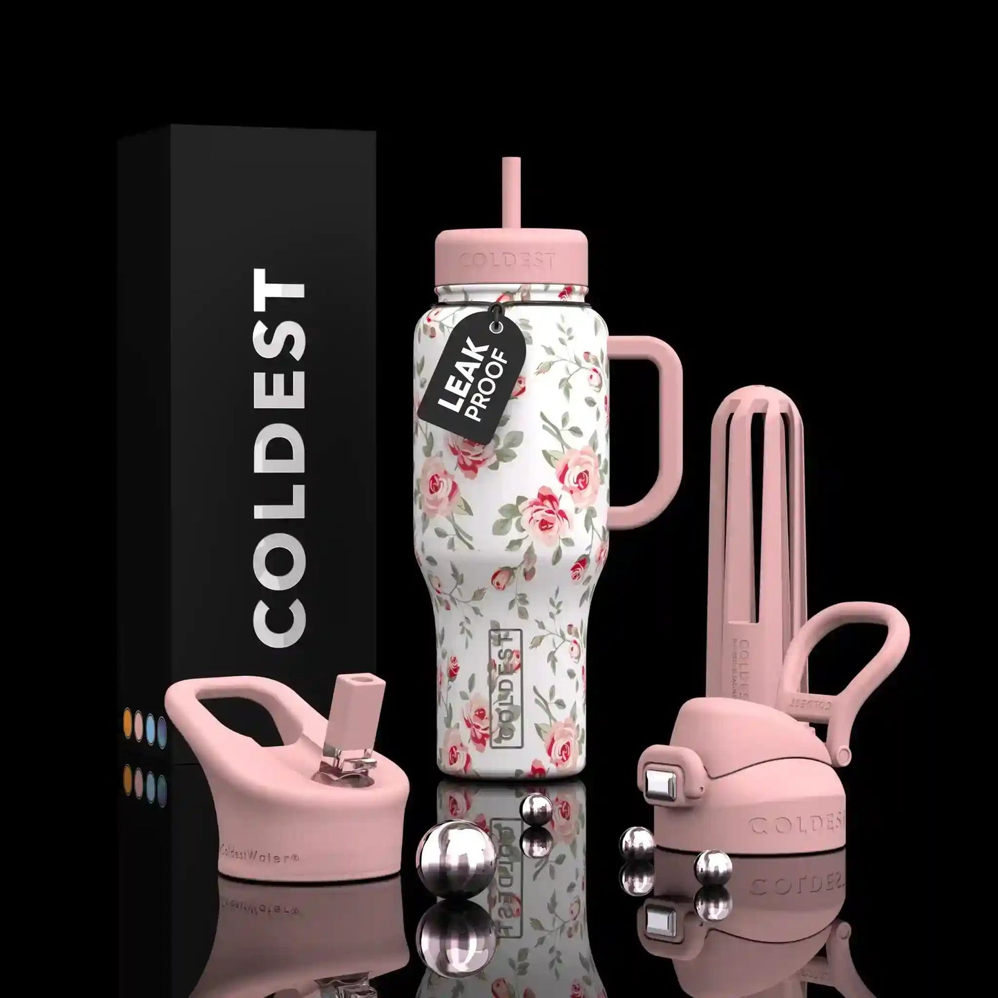 Floral-patterned water bottle with pink accents and accessories on a black background