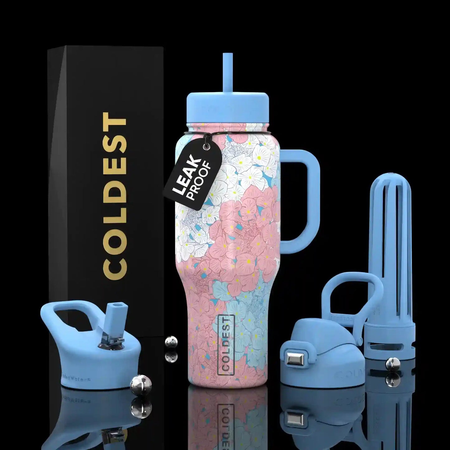 Leak-proof water bottle with accessories on a reflective surface
