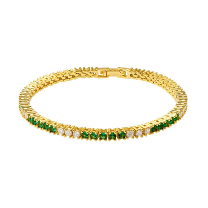 Gold metal tennis bracelet featuring a row of round green and clear stones, shown in a circular arrangement.