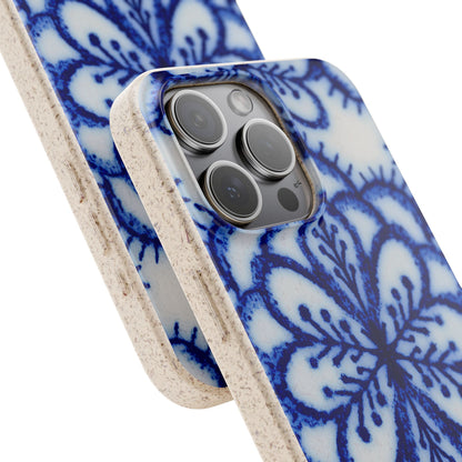 A close-up of a smartphone case with a blue and white floral mandala pattern and a natural beige textured edge, shown on a white background.
