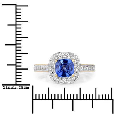 Genuine blue sapphire and white diamond ring in 18K yellow gold, featuring a cushion-cut sapphire and halo setting.