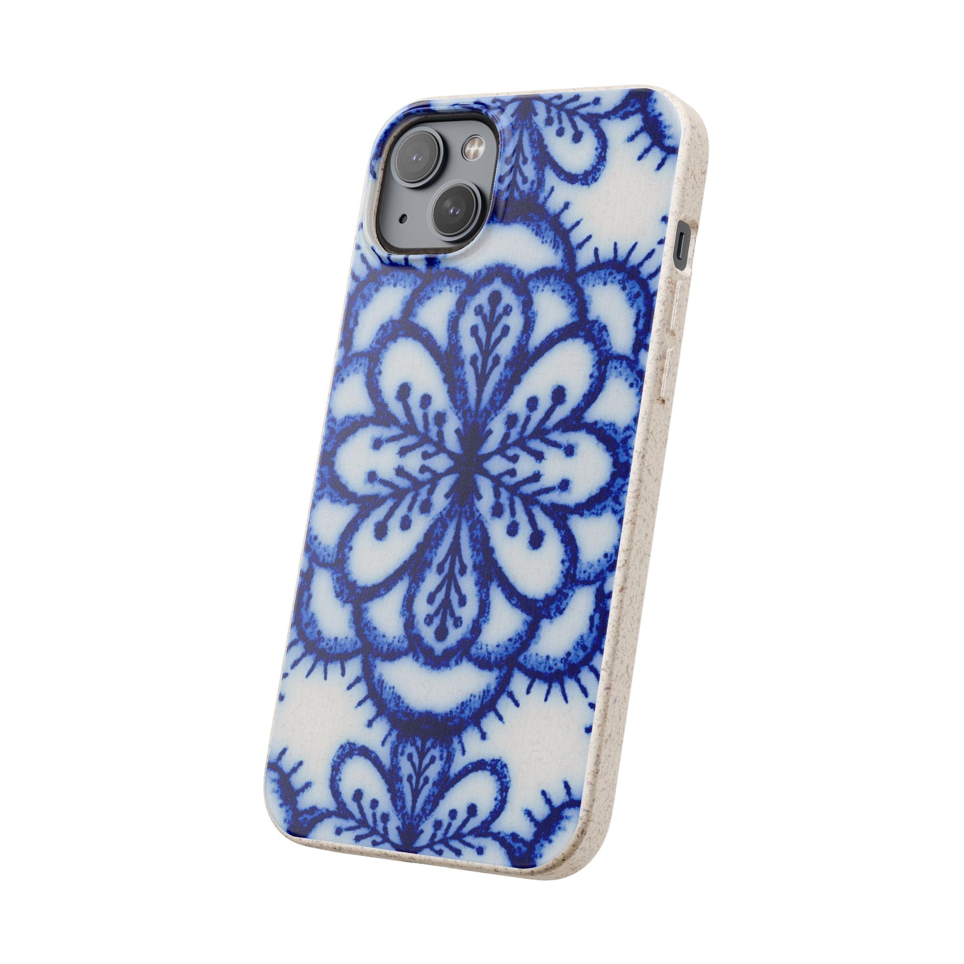A phone case with a blue and white floral mandala pattern on a white background, featuring a natural light wood edge.