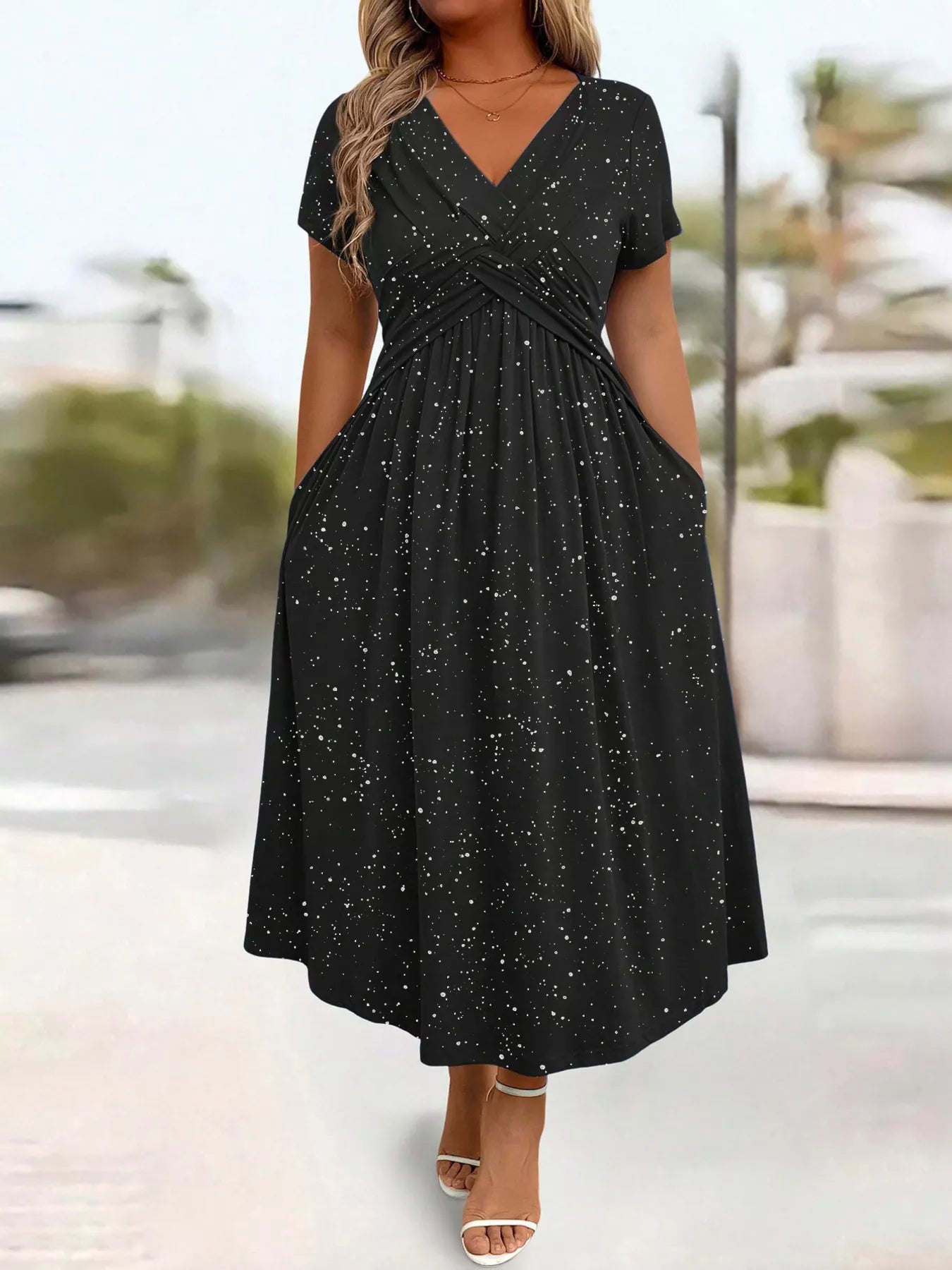 Black dress with star pattern worn by a person outdoors