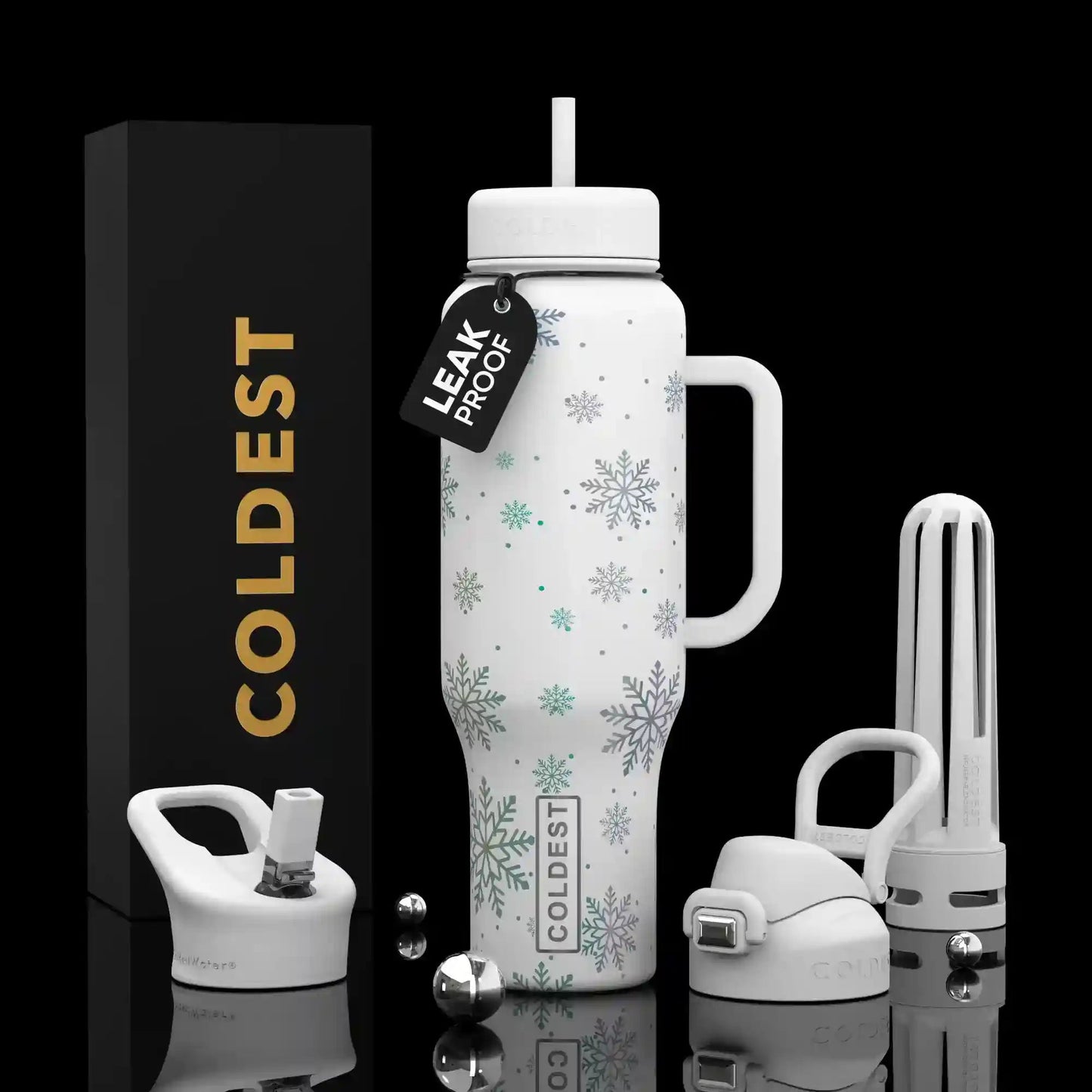 White insulated bottle with snowflake design, packaging, and accessories on a black background