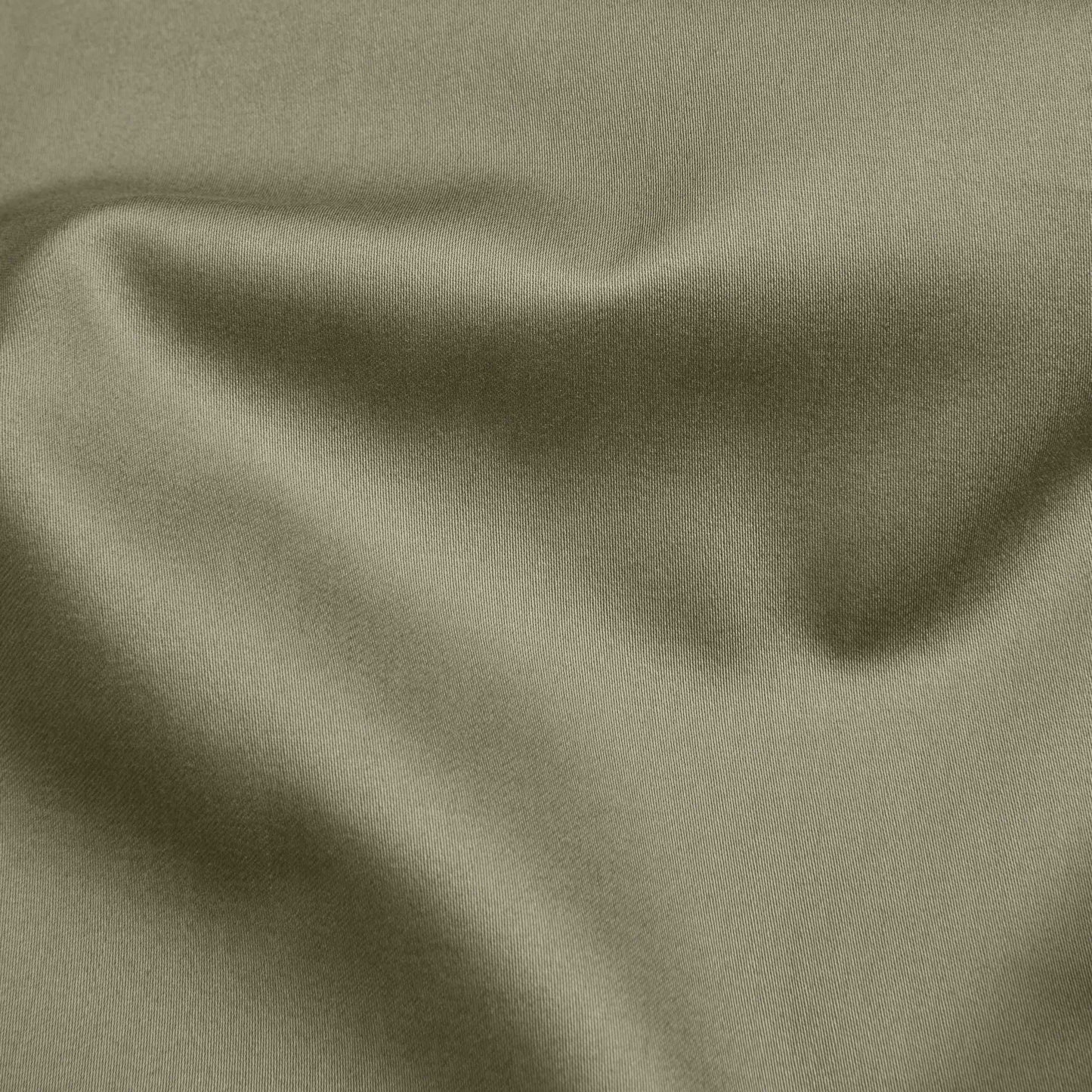 Close-up of olive green fabric with folds