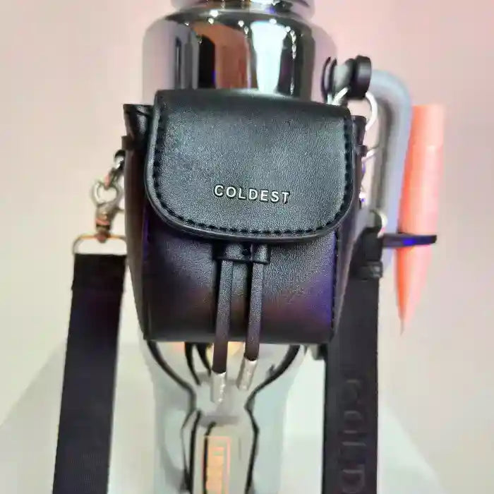 Coldest water bottle with a black mini backpack and squeeze holder, featuring a key hanger and mint box.