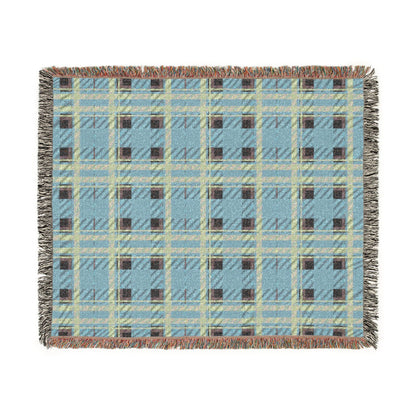 A square woven throw blanket with a light blue plaid pattern, featuring cream, brown, and gray stripes, fringed edges, and a subtle woven texture, shown flat on a white background.