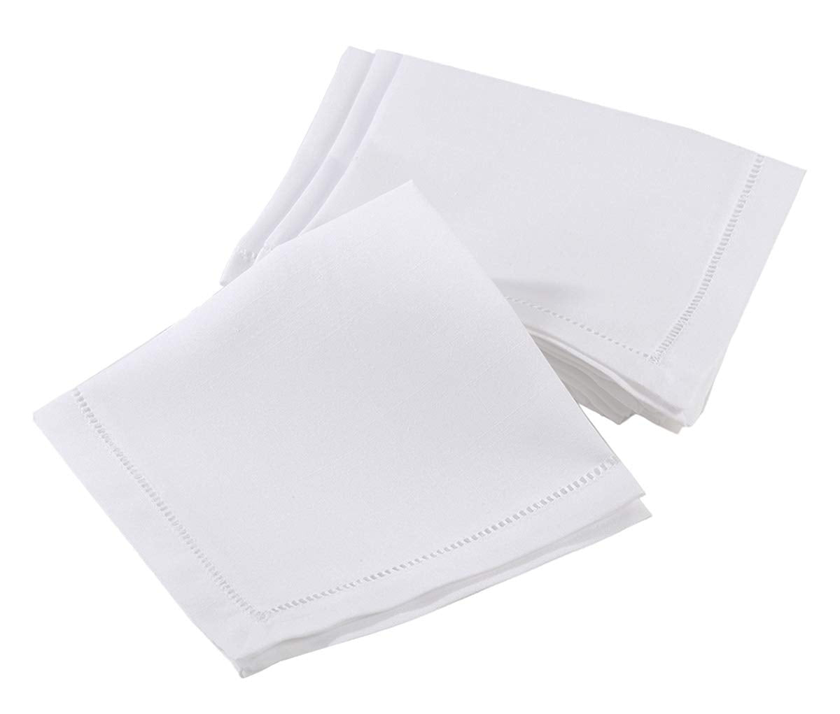 Four white square cotton napkins with delicate hemstitch borders, arranged in a fan-like stack on a solid white background.