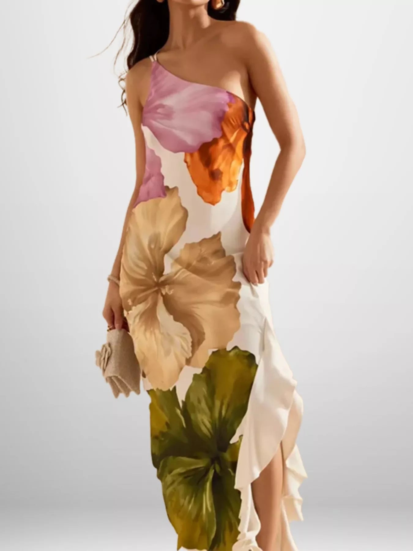 Woman wearing a floral one-shoulder dress on a white background
