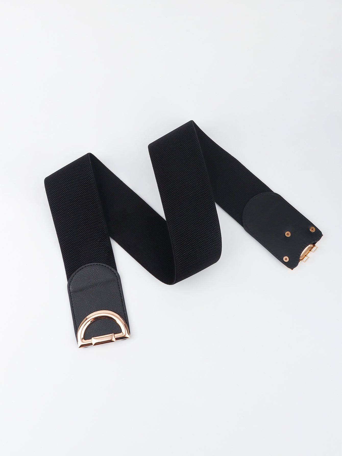 Black belt with gold hardware on a white background
