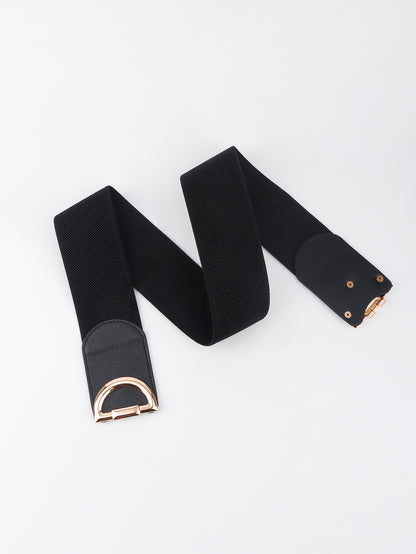Black belt with gold hardware on a white background