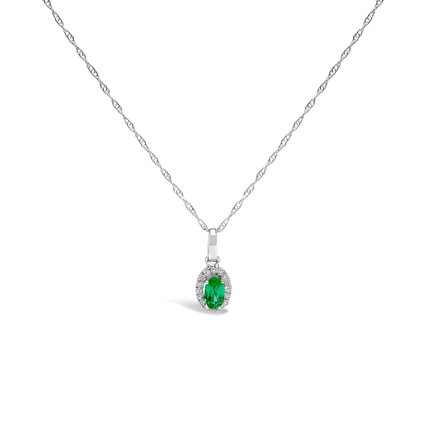 10K white gold pendant necklace featuring a 5x3mm green emerald surrounded by diamond accents on an 18" chain.