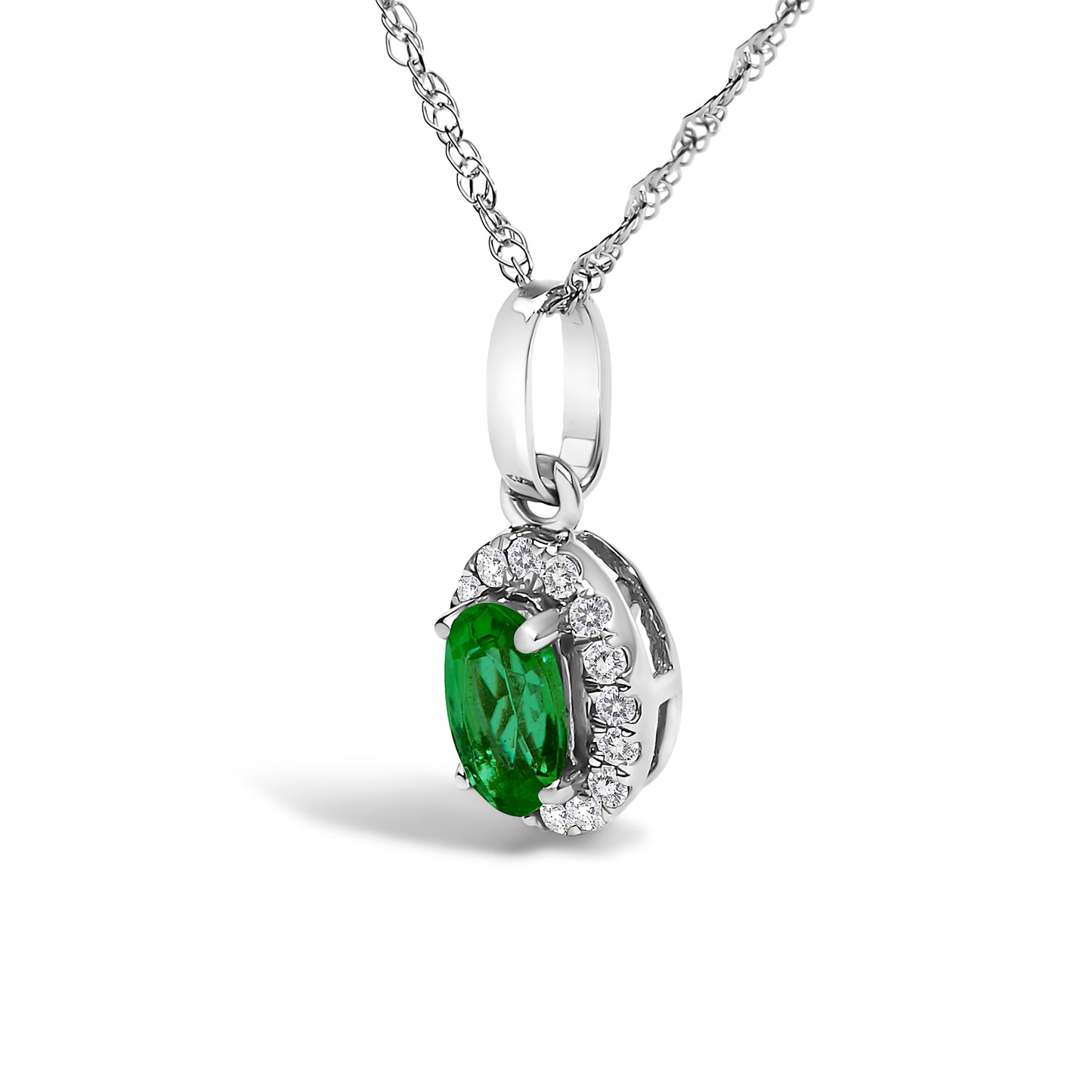 10K white gold pendant necklace featuring a 5x3mm green emerald surrounded by diamond accents in an oval shape.