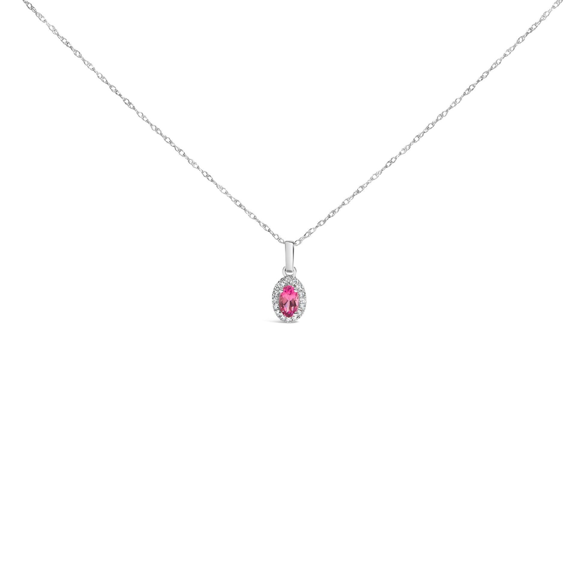 10K white gold pendant necklace featuring a 5x3mm green emerald with diamond accents in an oval halo setting.