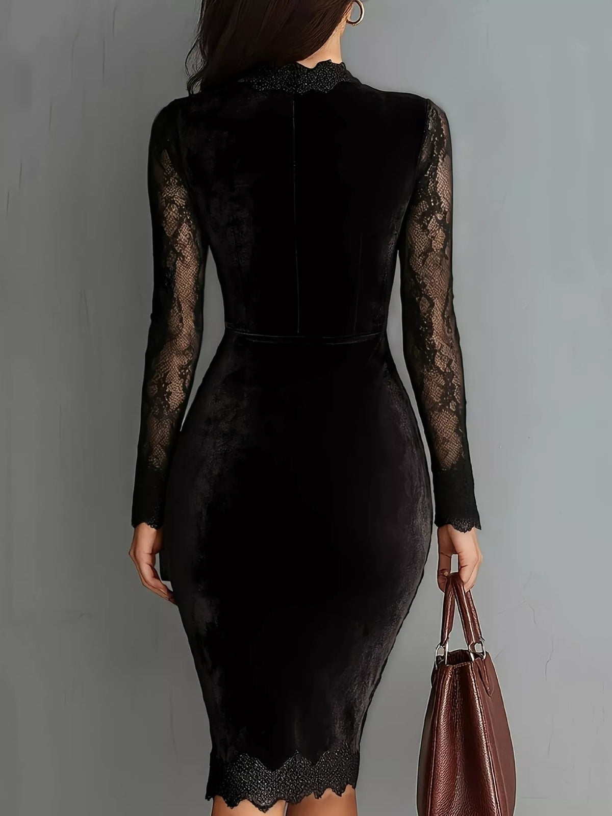 Model wearing a black velvet bodycon dress with sheer long lace sleeves, a chest cutout and lace-trimmed hem