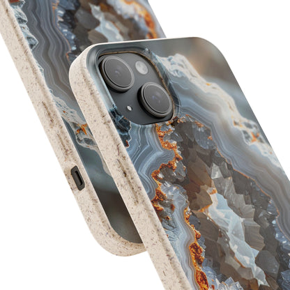 A close-up of a smartphone case with a geode or agate-style abstract pattern in gray, blue, white, and rust-orange tones, with a speckled beige bumper edge. No person, animal, or real environment is present, so this is Product/Packaging.