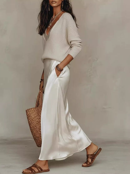 Side view of apricot top and ivory satin midi skirt, showing the side pocket.