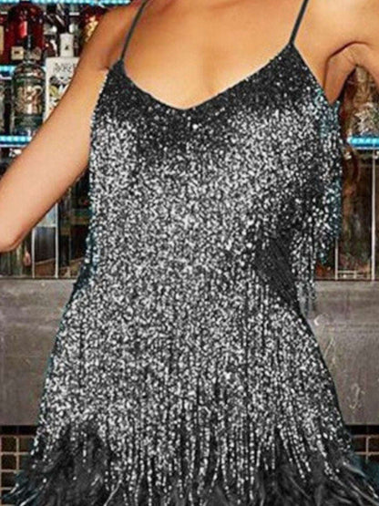Silver sequin dress worn by a person in a bar setting