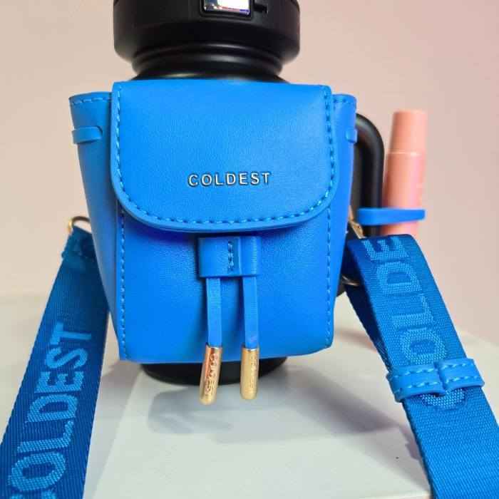 Coldest water bottle in a mint blue mini backpack holder with key hanger and squeeze holder attached.