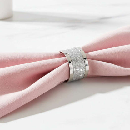A wide silver band ring featuring a textured, glittery silver inlay between polished silver sides, shown on a clean white background.