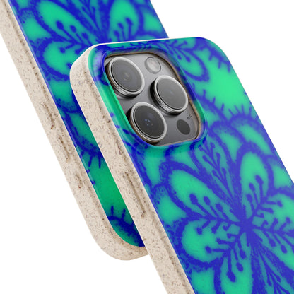 A close-up of a smartphone case with a bright green and blue floral mandala pattern and a natural beige textured edge, shown fitted on a phone against a white background.